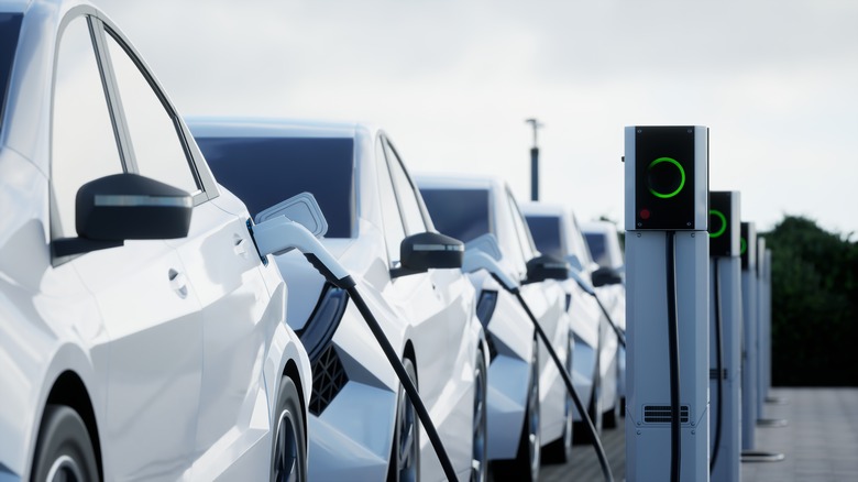 White electric vehicles charging 