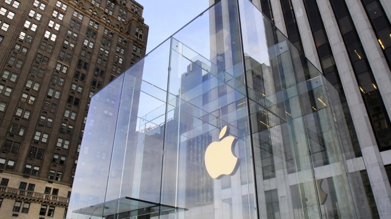 A glass building with the Apple logo