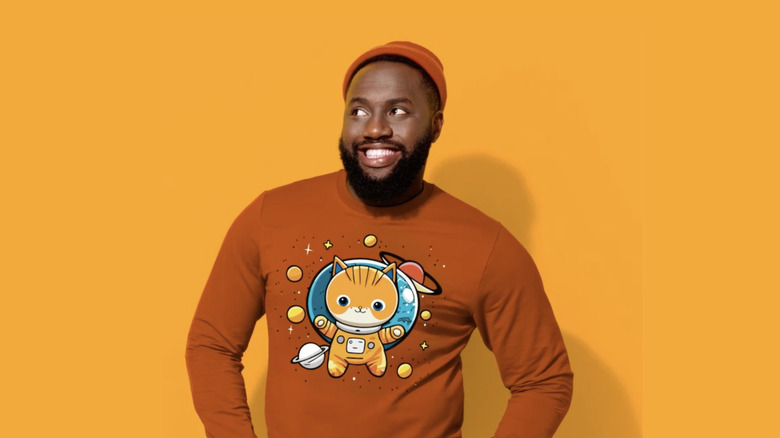 person modeling sweatshirt with vector art