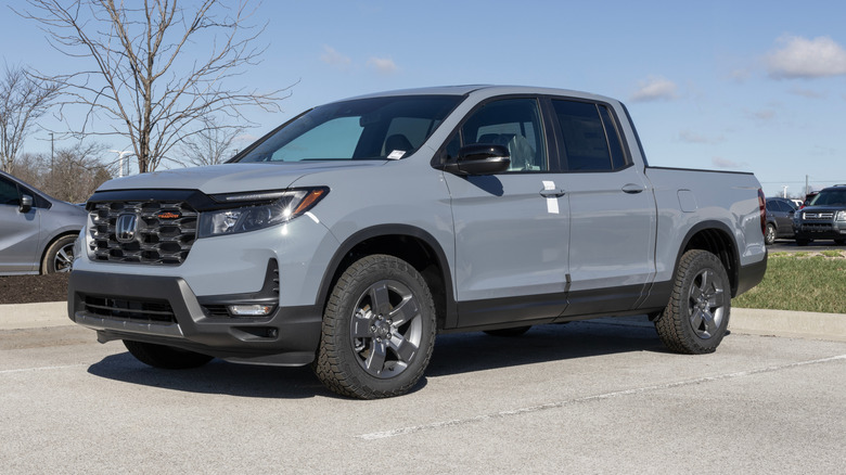 A late model Honda Ridgeline in a parking lot