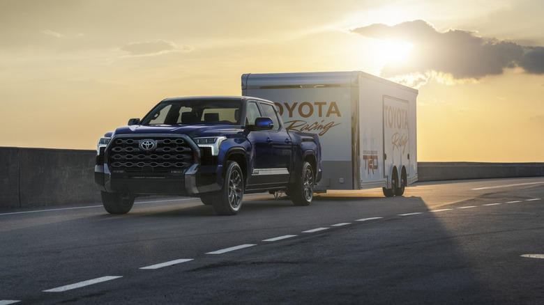 A Toyota Tundra hauling a trailer on a highway