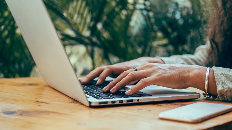 Woman Using Laptop in cafe