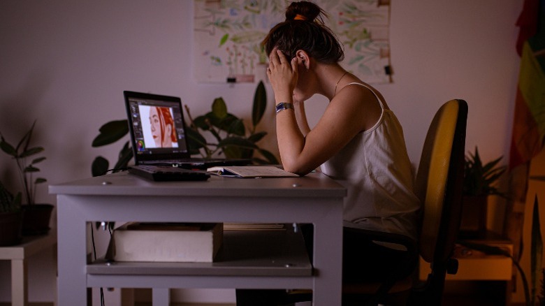 stressed woman using Photoshop