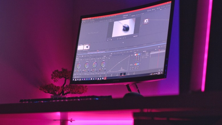 editing software on monitor with pink backlight