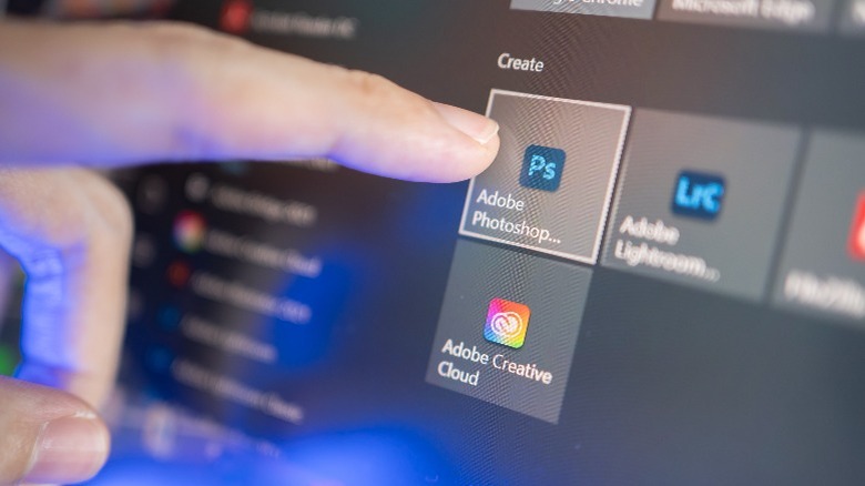 finger tapping Photoshop icon on Windows
