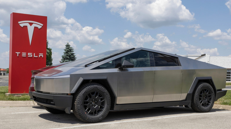 Tesla Cybertruck parked outside Tesla dealership