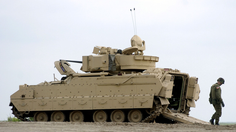 Soldier exiting Bradley Fighting Vehicle