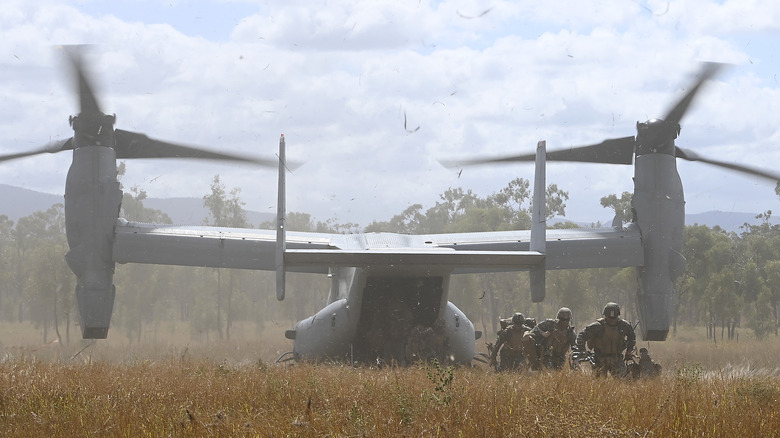 Personnel deploying from V-22 Osprey