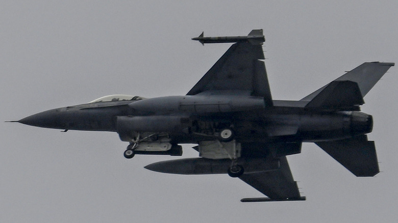 Portuguese F-16 flying grey skies