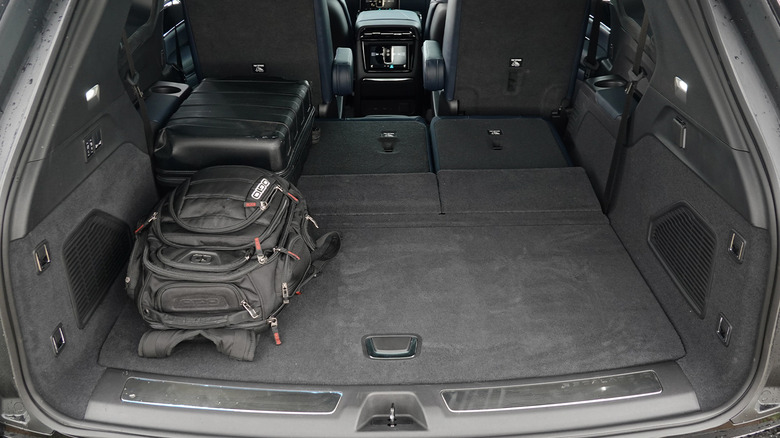 2025 Cadillac Escalade IQ rear seats folded with luggage