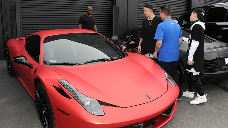 Justin Bieber with his modified Ferrari 458 Italia