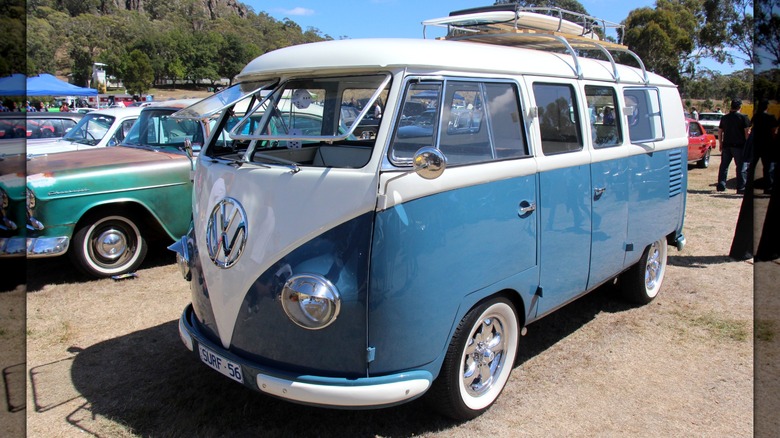 White and blue 1956 Volkswagen Type 2 parked at a car show