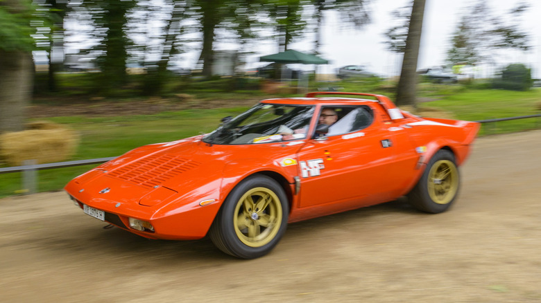 Lancia Stratos HF classic 1970s rally car driving past