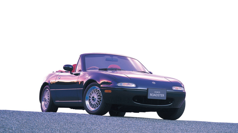 Blue Mazda MX-5 Miata NA Eunos front 3/4 view