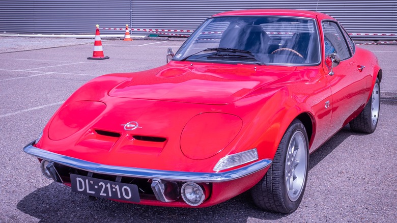 Red 1968 Opel GT front 3/4 view parked outside