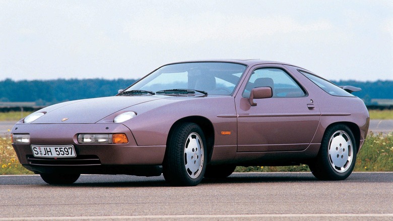 Purple Porsche 928 parked on an empty street