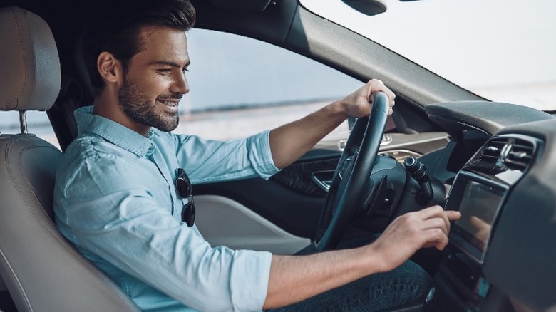 Man playing with car stereo