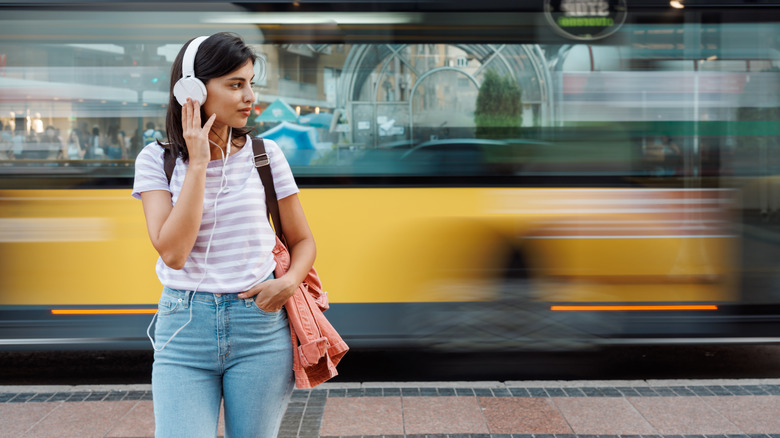 Person walking wearing headphones