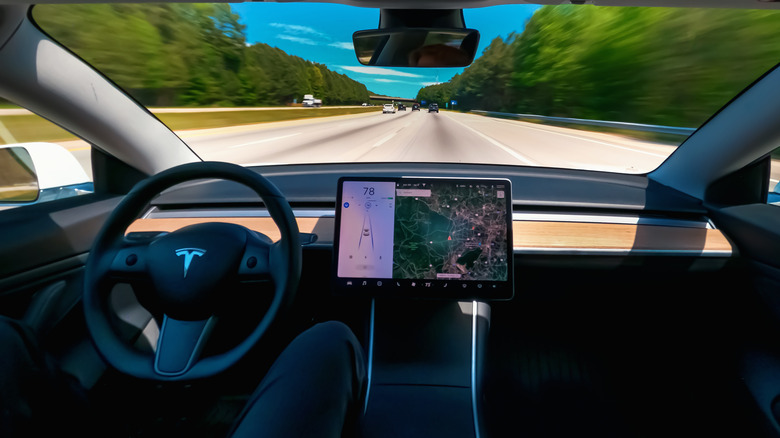 Person drives a Tesla on Autopilot