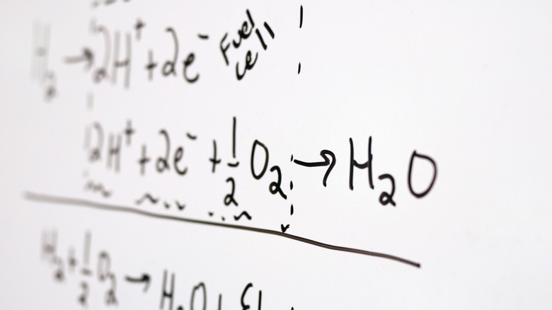 equations on white board describing water fuel cell operation