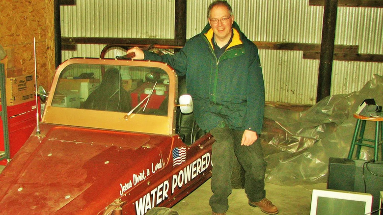 Stanley Meyer in his workshop with his water-powered car prototype