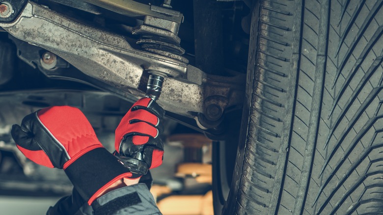 Mechanic doing suspension repair