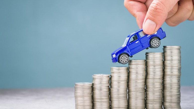 Toy car driving down descending coins