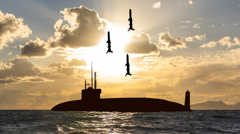 Submarine launching missiles at sea