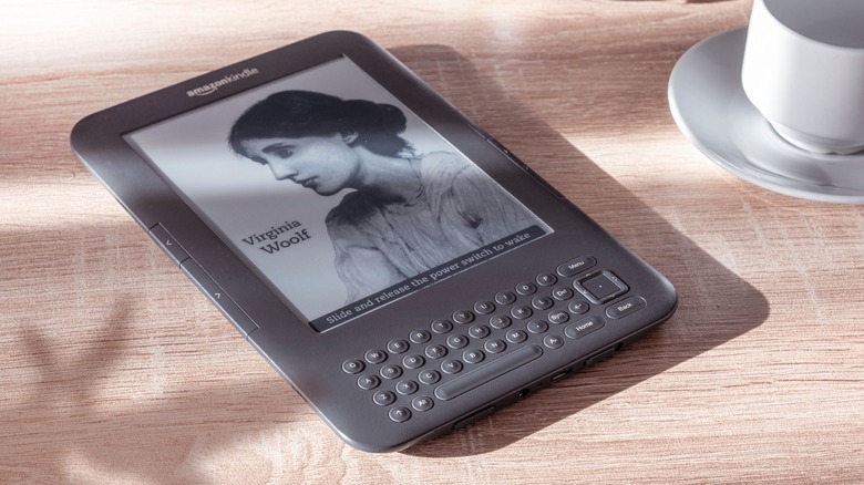 Amazon Kindle Keyboard on wood-grain surface