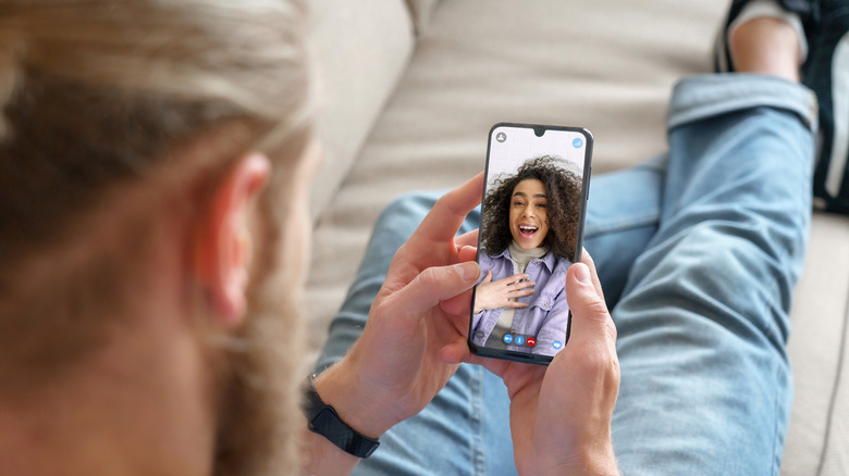 man and woman facetiming