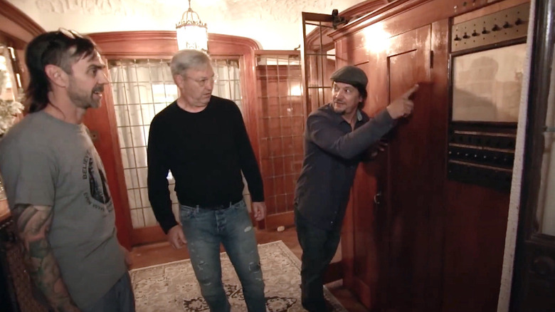 "American Pickers" stars Robbie Wolfe and Jersey Jon Szalay look at the home's control panel.