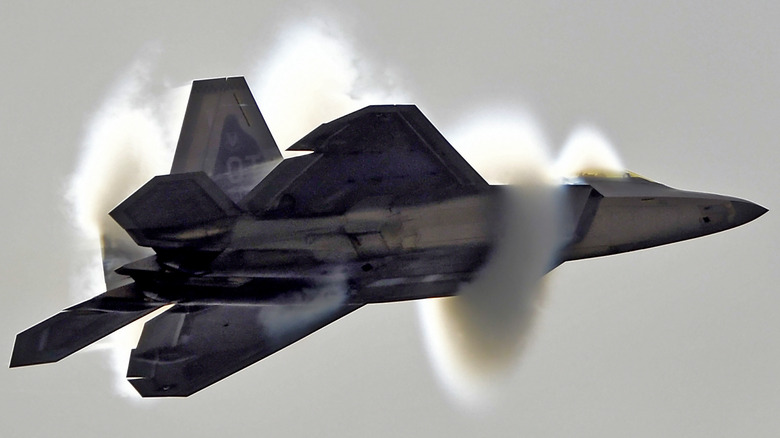 An F-35 with water vapor coming off it.