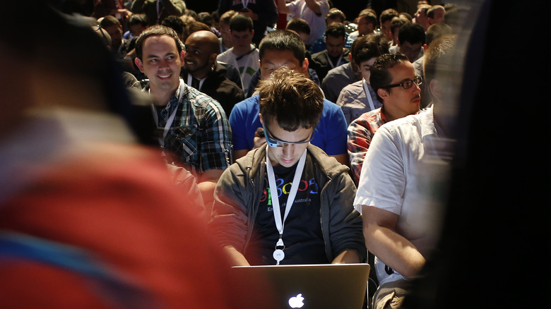 person wearing Google Glass in crowd