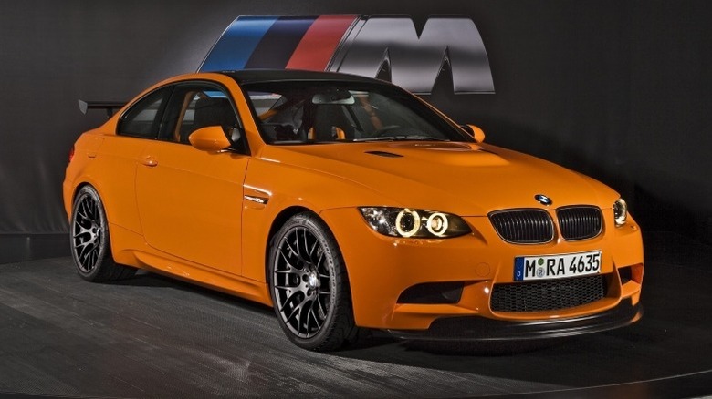 Front 3/4 static shot of BMW BMW M3 GTS with BMW M logo in the background