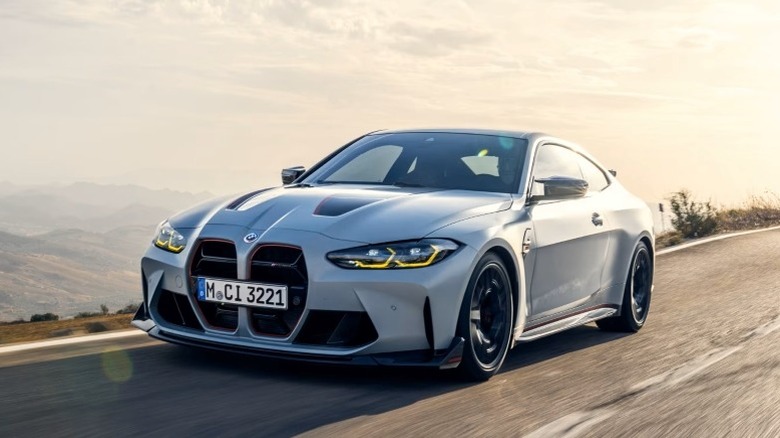 BMW M4 CSL driving on a road