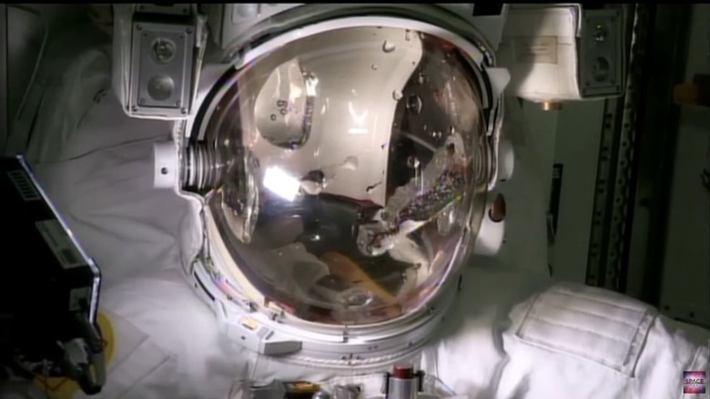 Astronaut helmet with water inside on visor