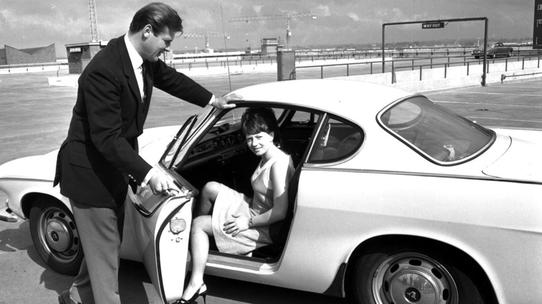 Roger Moore and the Jensen-built white Volvo P1800 in "The Saint."