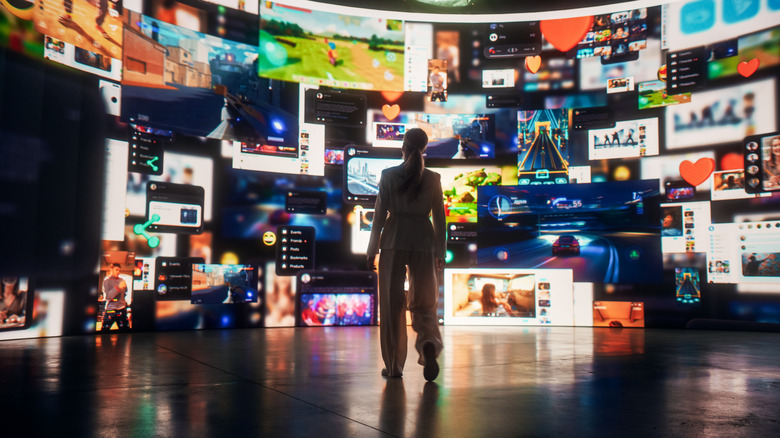 woman looking at a wall of streaming platforms