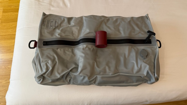 Ekster TravelPack on a bed