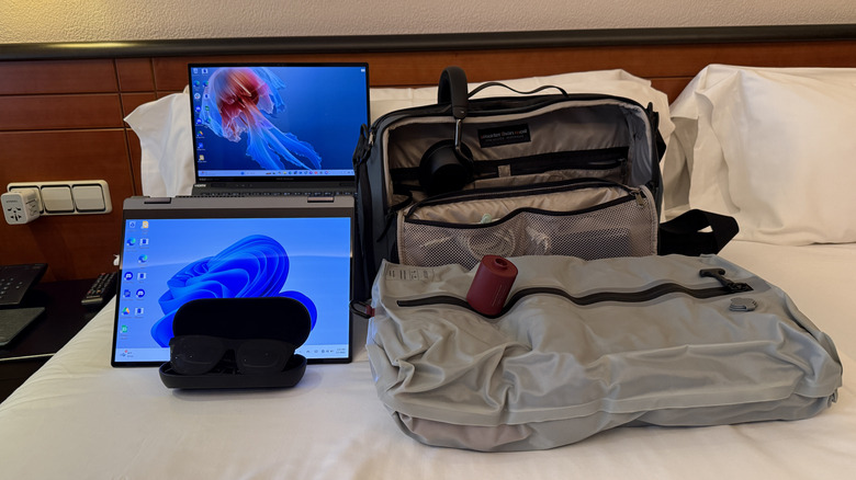 travel gear laid out on a bed