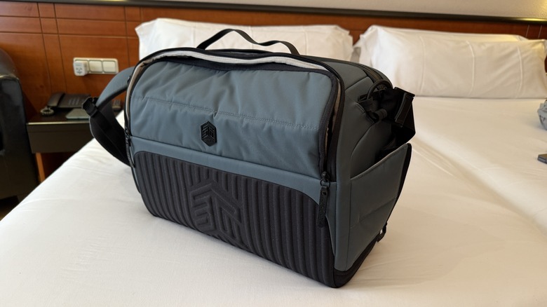 STM Dux 16L Messenger bag on a bed