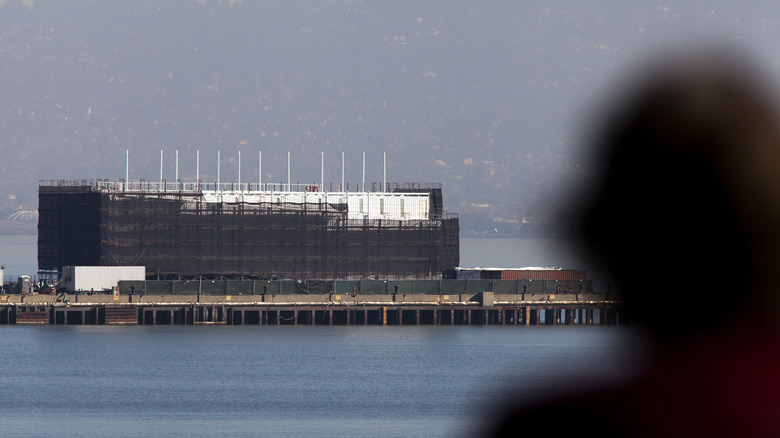 Man looking at Google barge