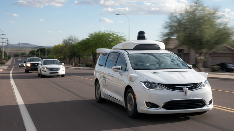 Waymo driverless minivan driving