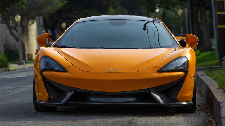 A McLaren car parked on a road.