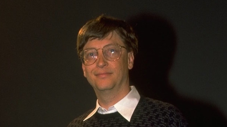 Bill Gates, hand rested on a CRT Monitor