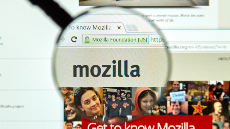 A magnifying glass over the Mozilla logo on the Mozilla webiste