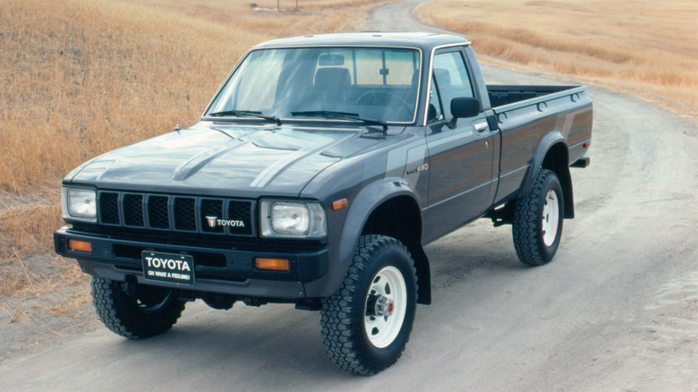 Toyota pickup truck fifth-gen on a country road front 3/4 view