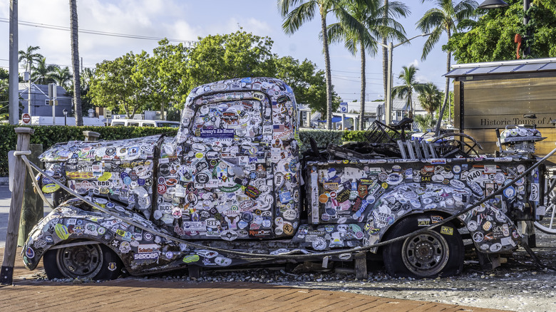 truck completely covered with bumper stickers