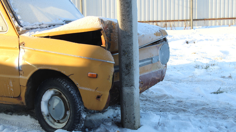 Old-fashioned car crashed into pole