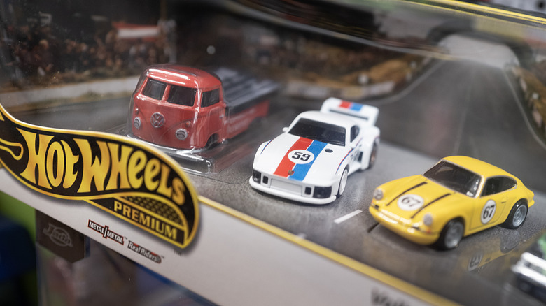 Three Hot Wheels cars on display